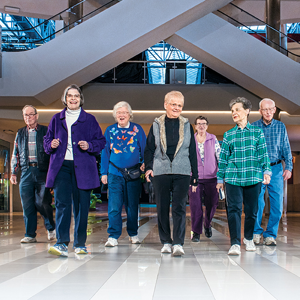 senior walking group at mall