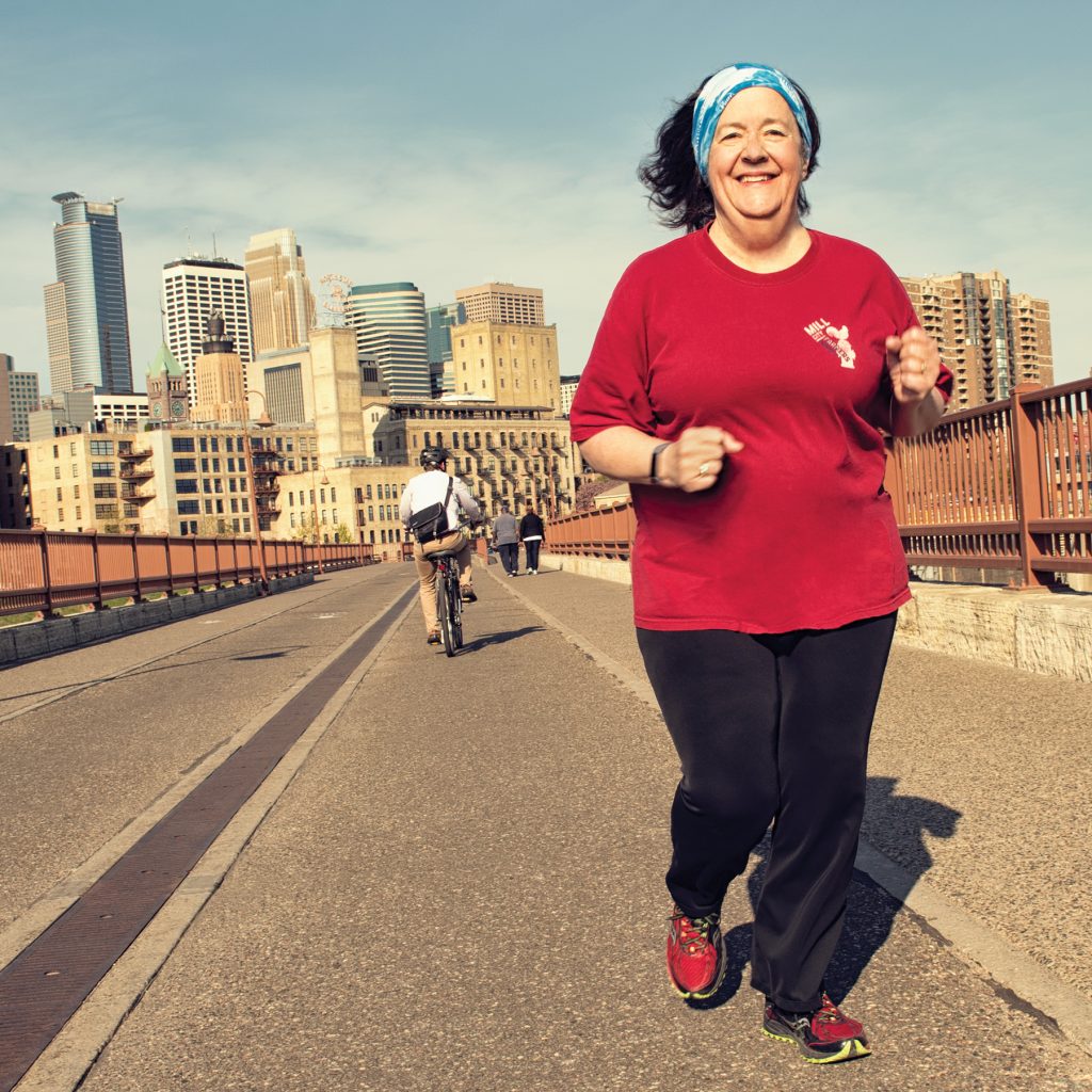 Claudia running on bridge